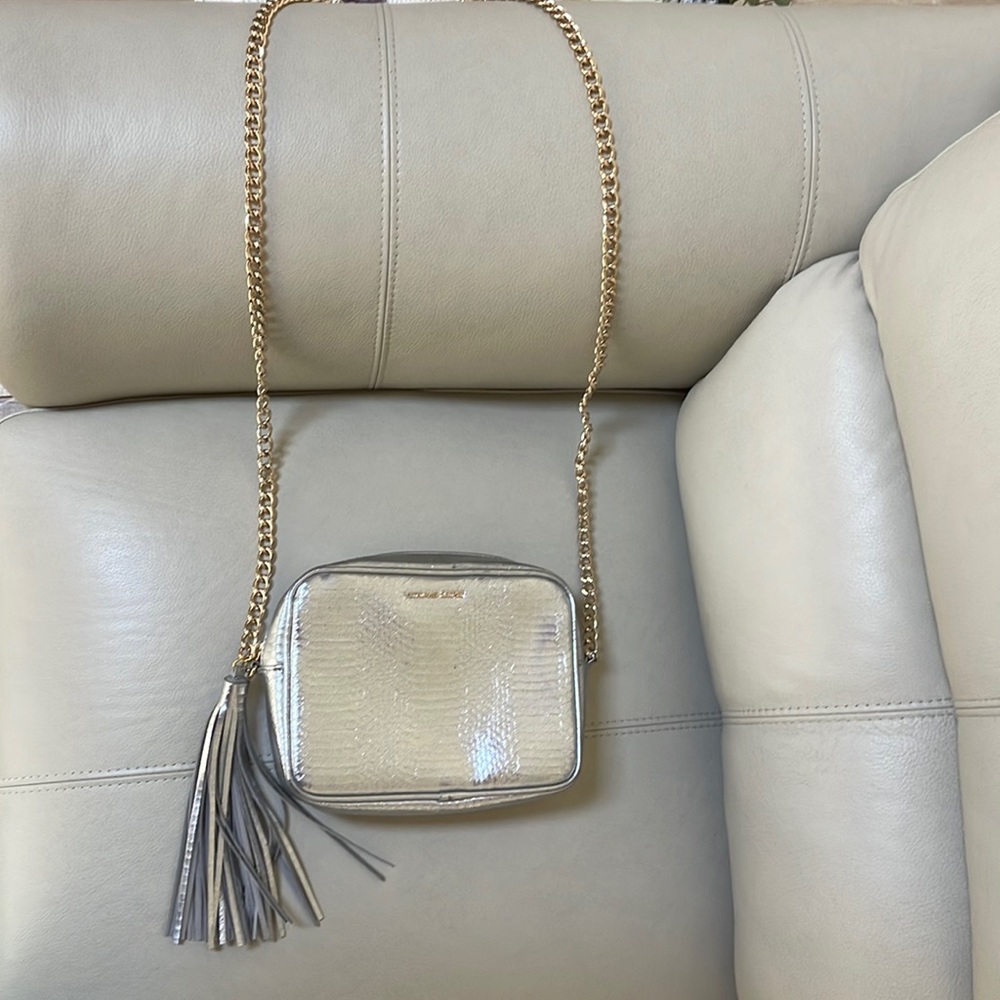 Victoria’s Secret silver purse with gold chain strap and tassel